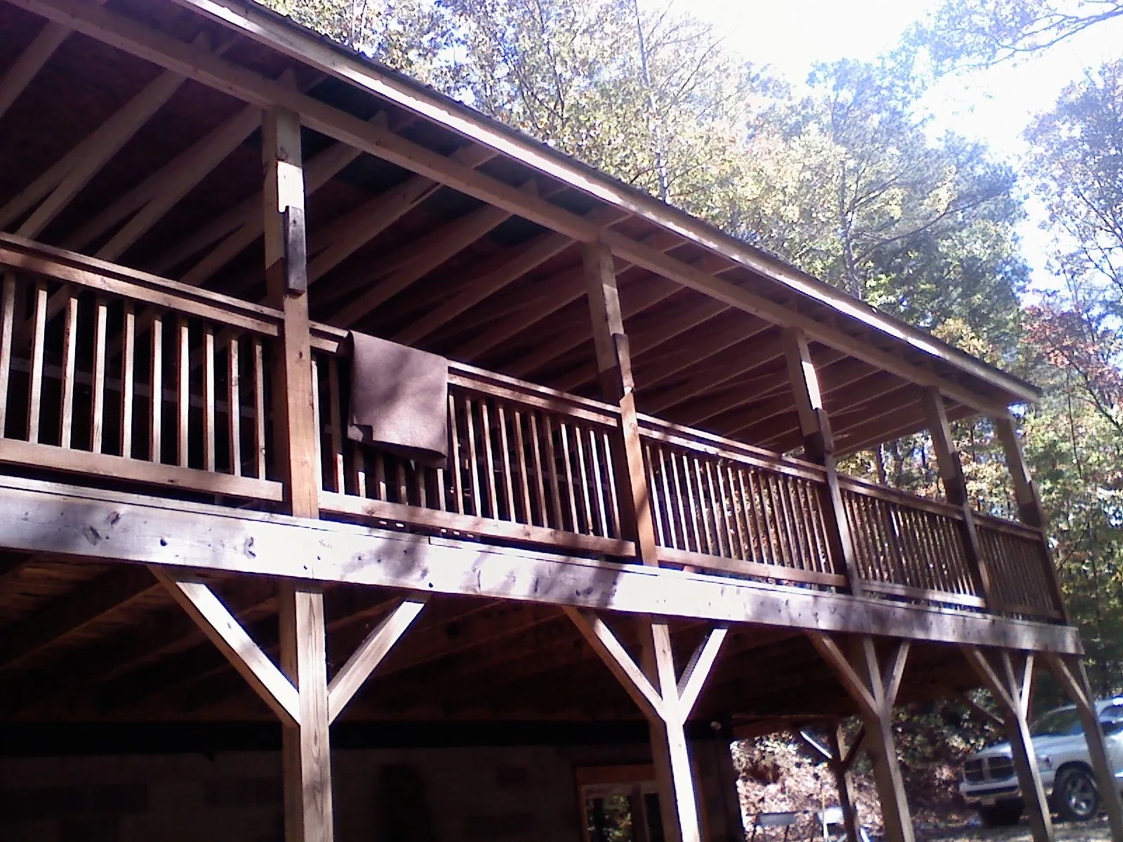Timber framing under a new elevated porch and deck — Roof Leak Repair in Cable by Roofing Brothers